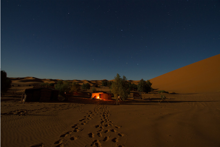 Desert camp at night.